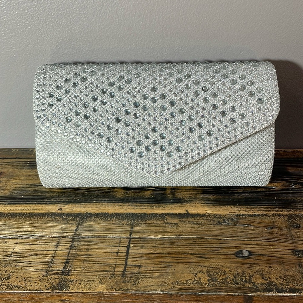 Shimmering silver clutch purse with faux diamonds!